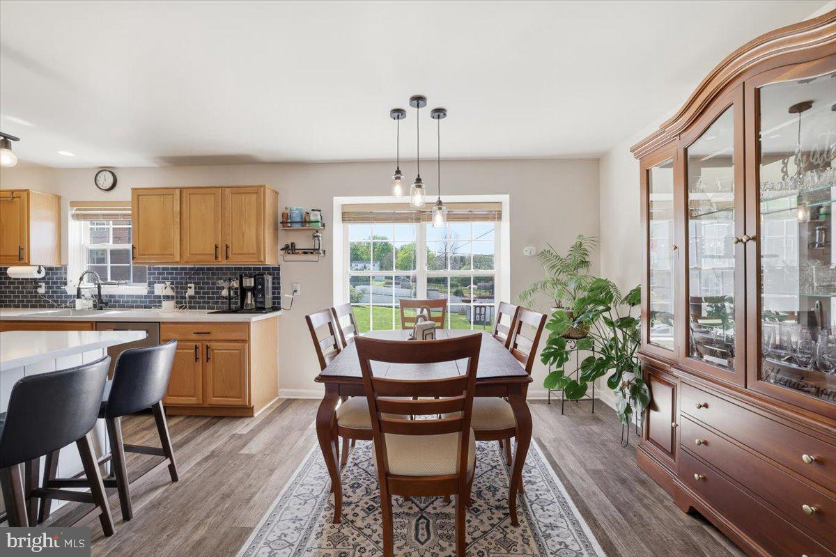 215 Birch Street Walnutport, PA 18088 - Photo 19 of 48 a dining room with furniture a chandelier and wooden floor