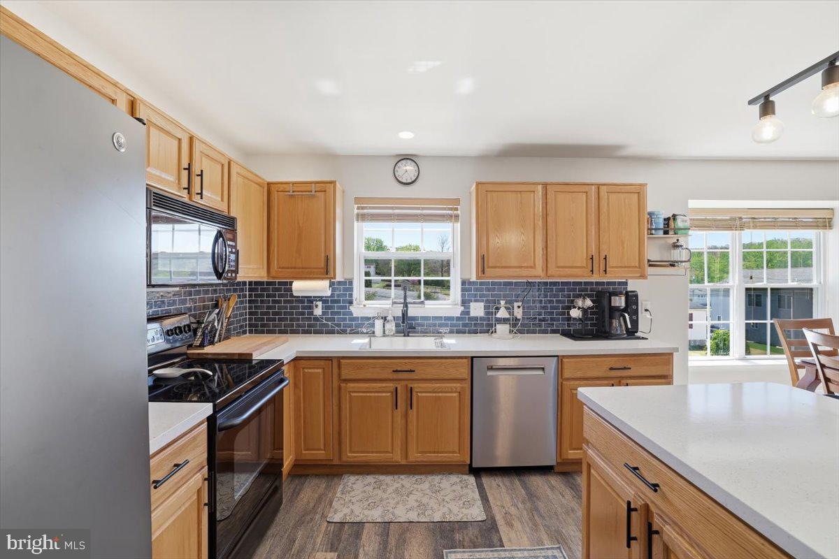 215 Birch Street Walnutport, PA 18088 - Photo 22 of 48 a kitchen with a sink stove and cabinets