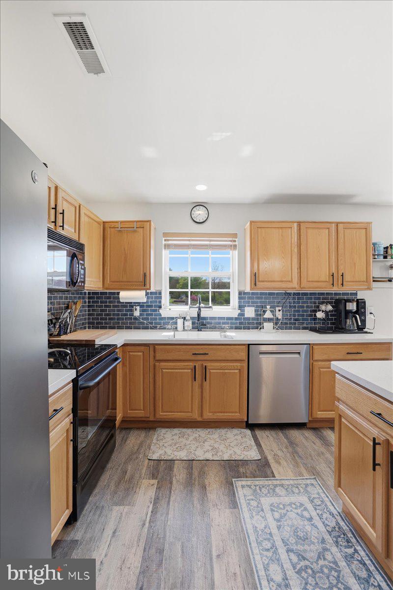 215 Birch Street Walnutport, PA 18088 - Photo 23 of 48 a kitchen with a stove a sink and a refrigerator