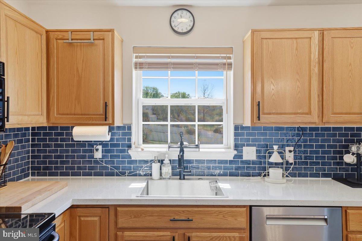 215 Birch Street Walnutport, PA 18088 - Photo 24 of 48 a kitchen with granite countertop a sink and a window