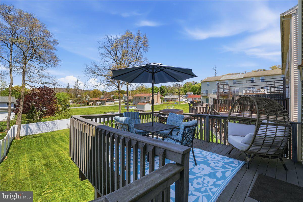 215 Birch Street Walnutport, PA 18088 - Photo 38 of 48 a view of a balcony with chairs and umbrella