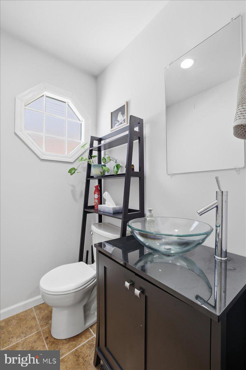 215 Birch Street Walnutport, PA 18088 - Photo 6 of 48 a bathroom with a toilet sink and mirror