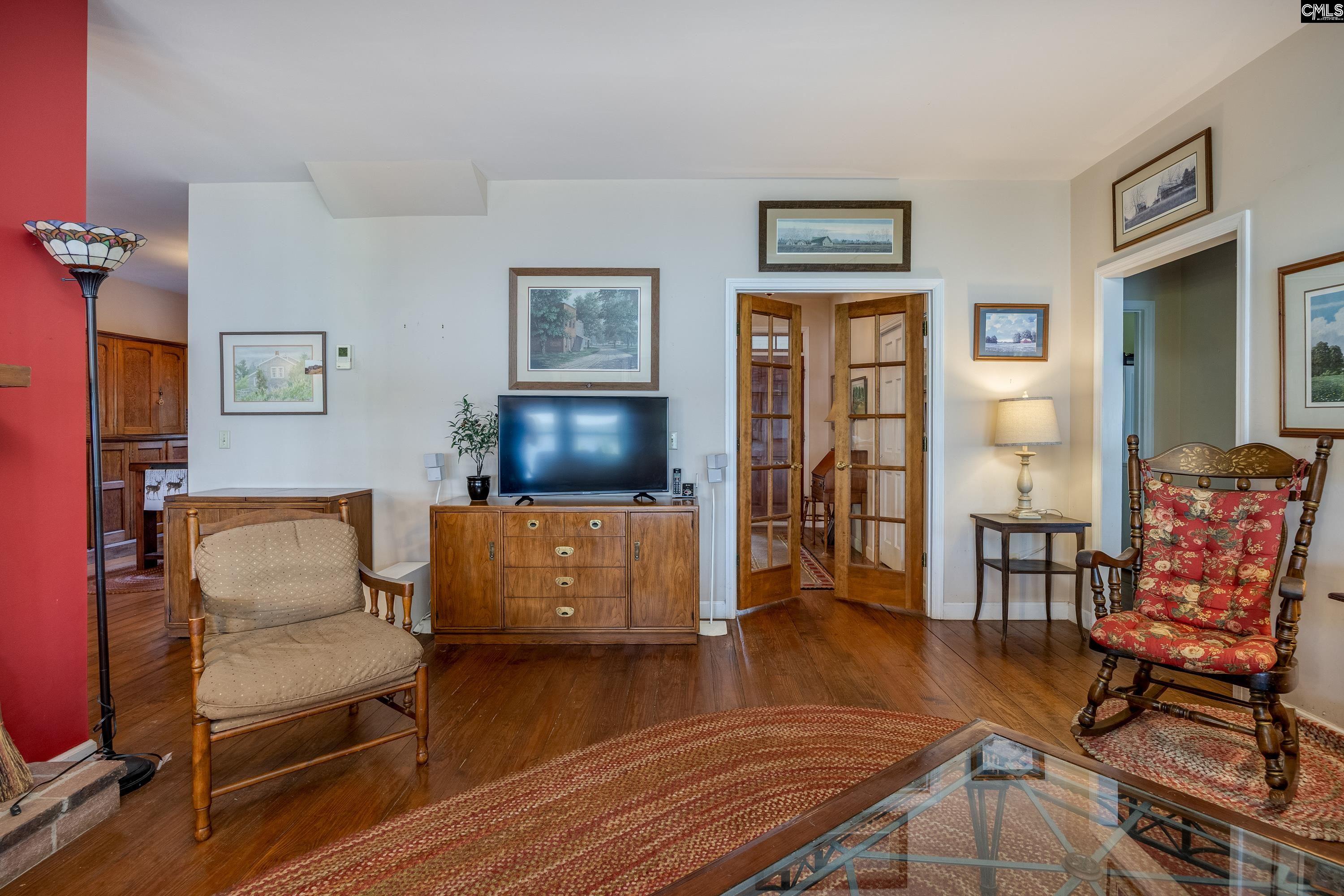 2577 Harbor View Road Camden, SC 29020 - Photo 15 of 42 a living room with furniture and a flat screen tv