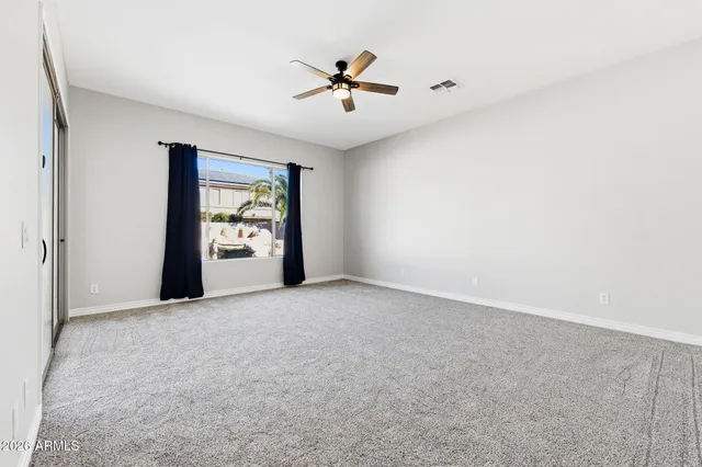 a kitchen with stainless steel appliances granite countertop a stove a sink and a window