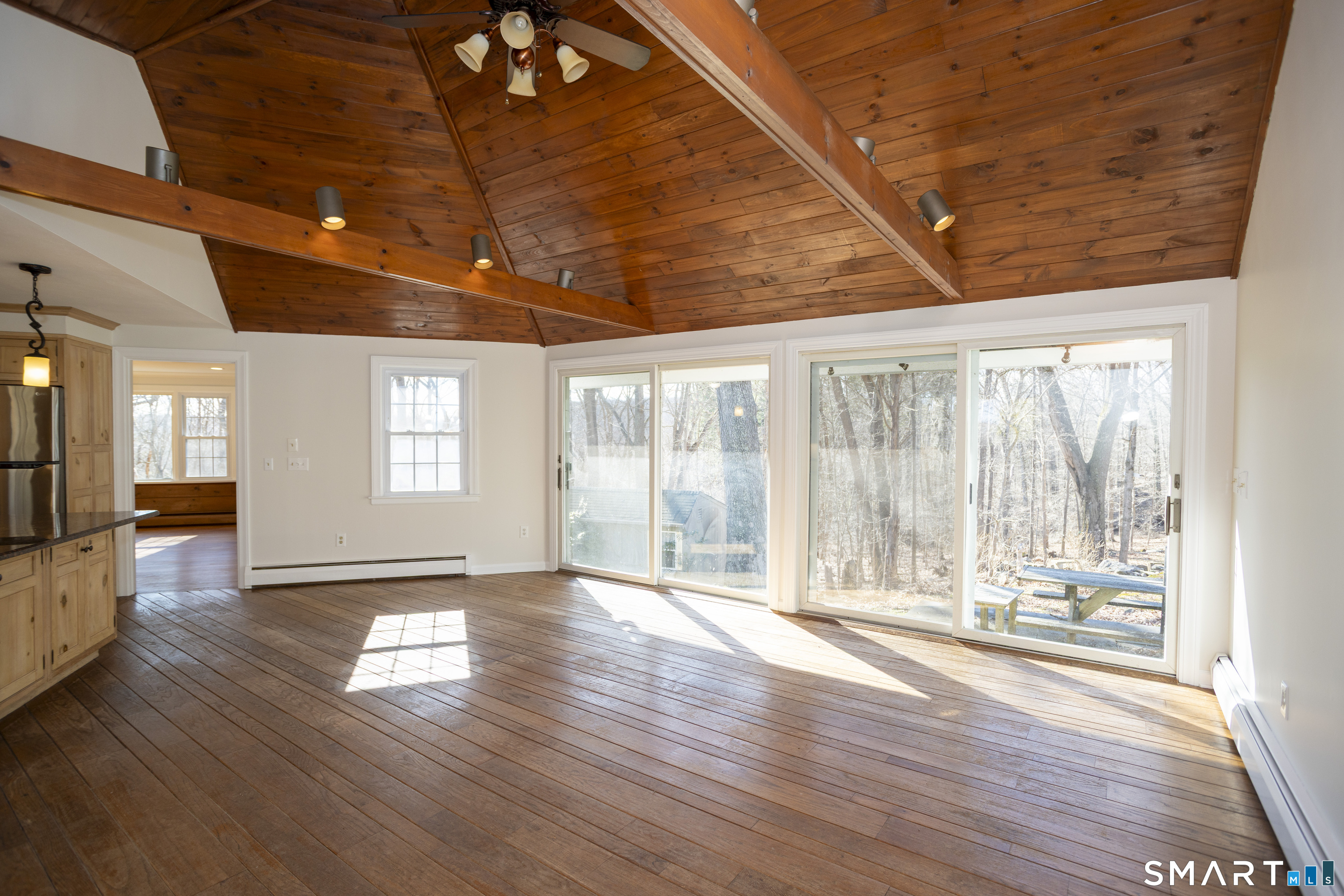 10 Cove Hill Road Essex, CT 06426 - Photo 14 of 38 a view of an empty room with wooden floor and a window