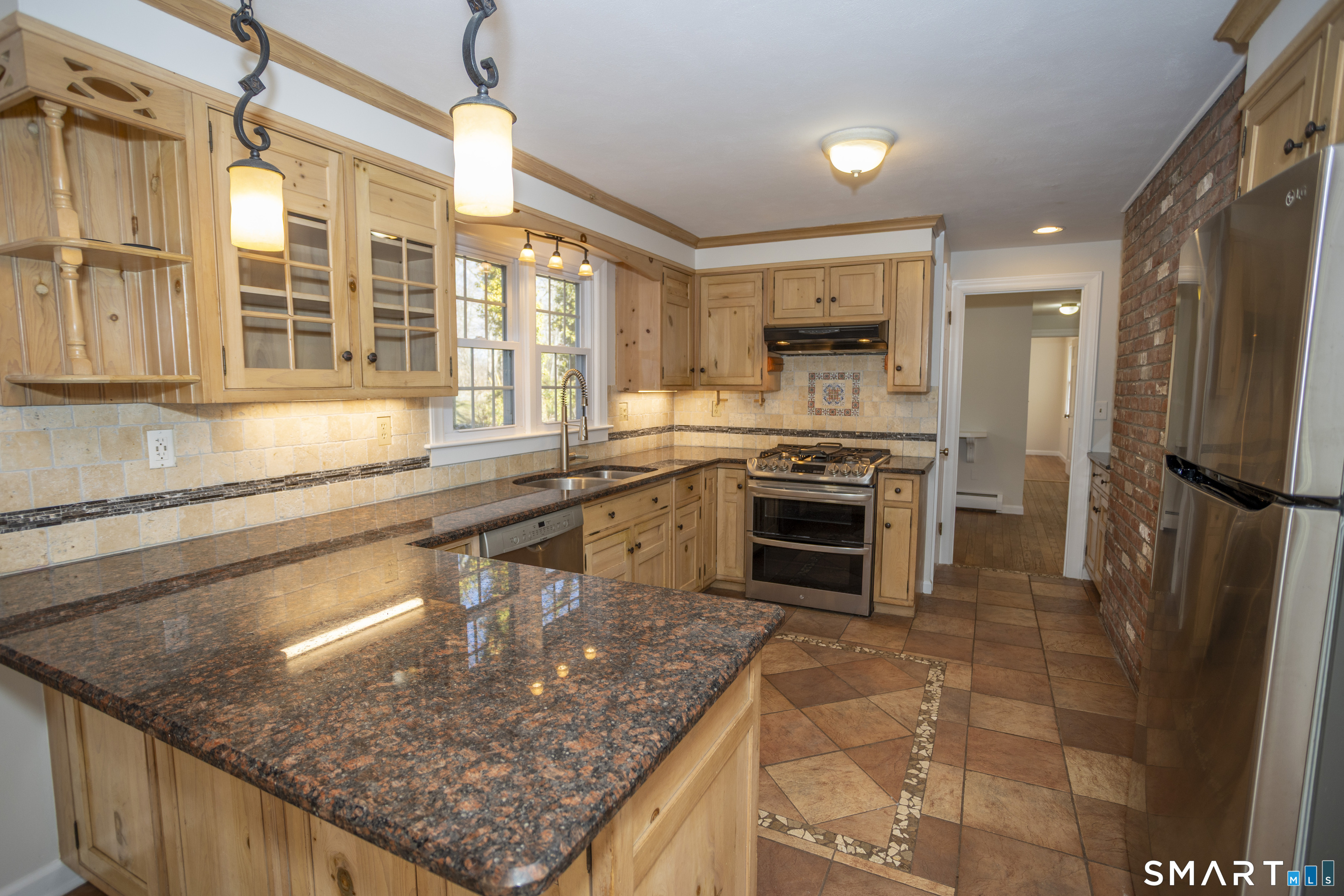 10 Cove Hill Road Essex, CT 06426 - Photo 18 of 38 a kitchen with a sink stove and refrigerator