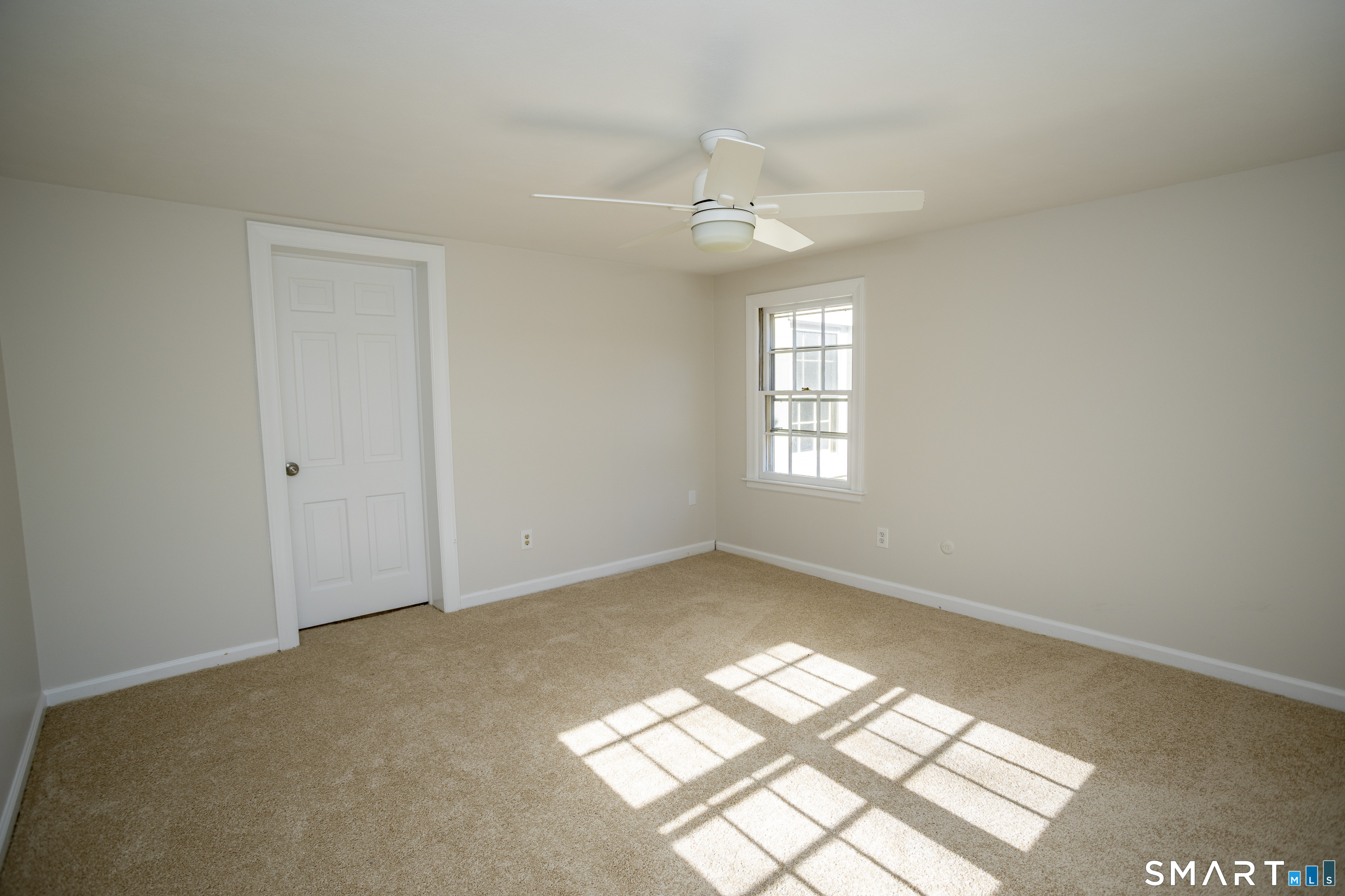 10 Cove Hill Road Essex, CT 06426 - Photo 26 of 38 an empty room with windows and fan