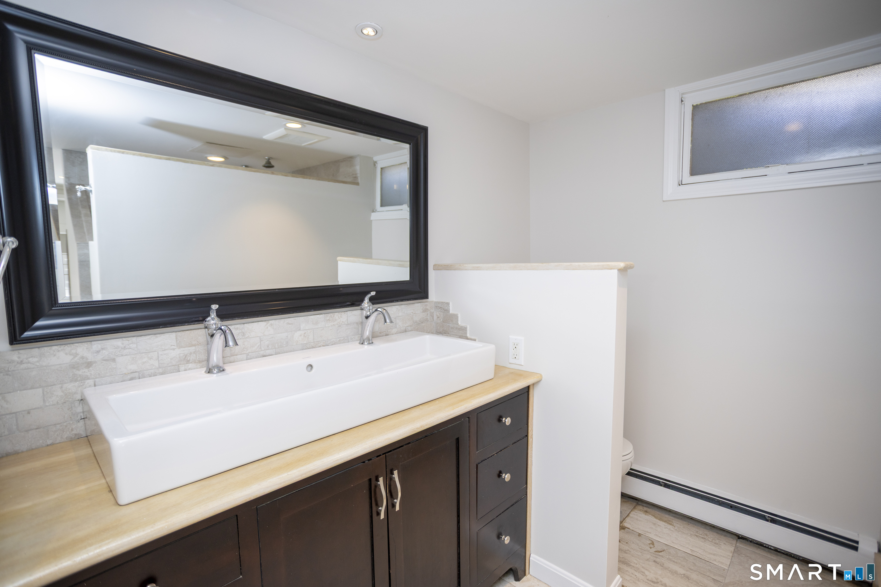 10 Cove Hill Road Essex, CT 06426 - Photo 27 of 38 a bathroom with a sink and a mirror