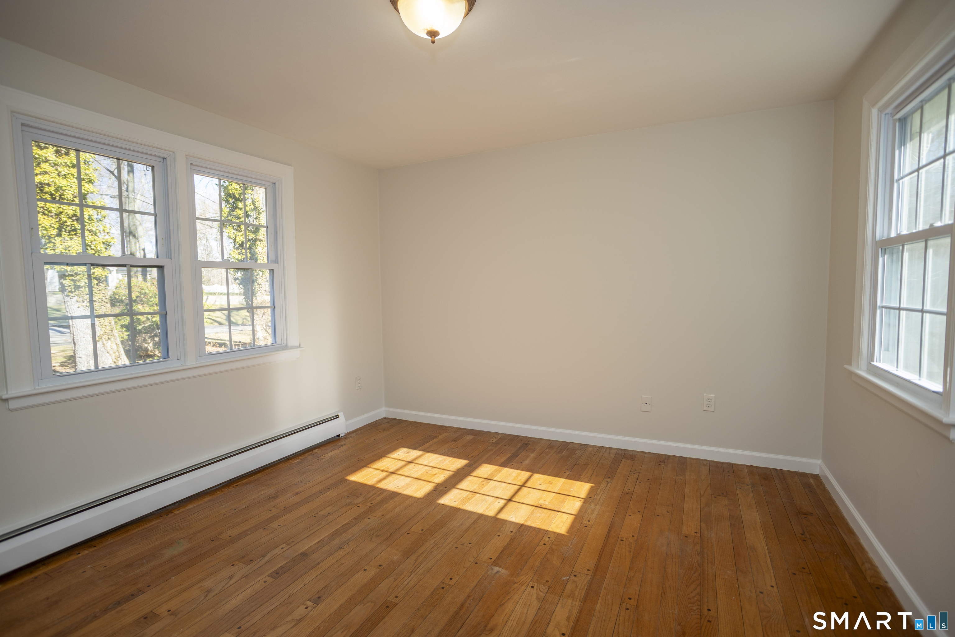 10 Cove Hill Road Essex, CT 06426 - Photo 33 of 38 a view of empty room with wooden floor and fan