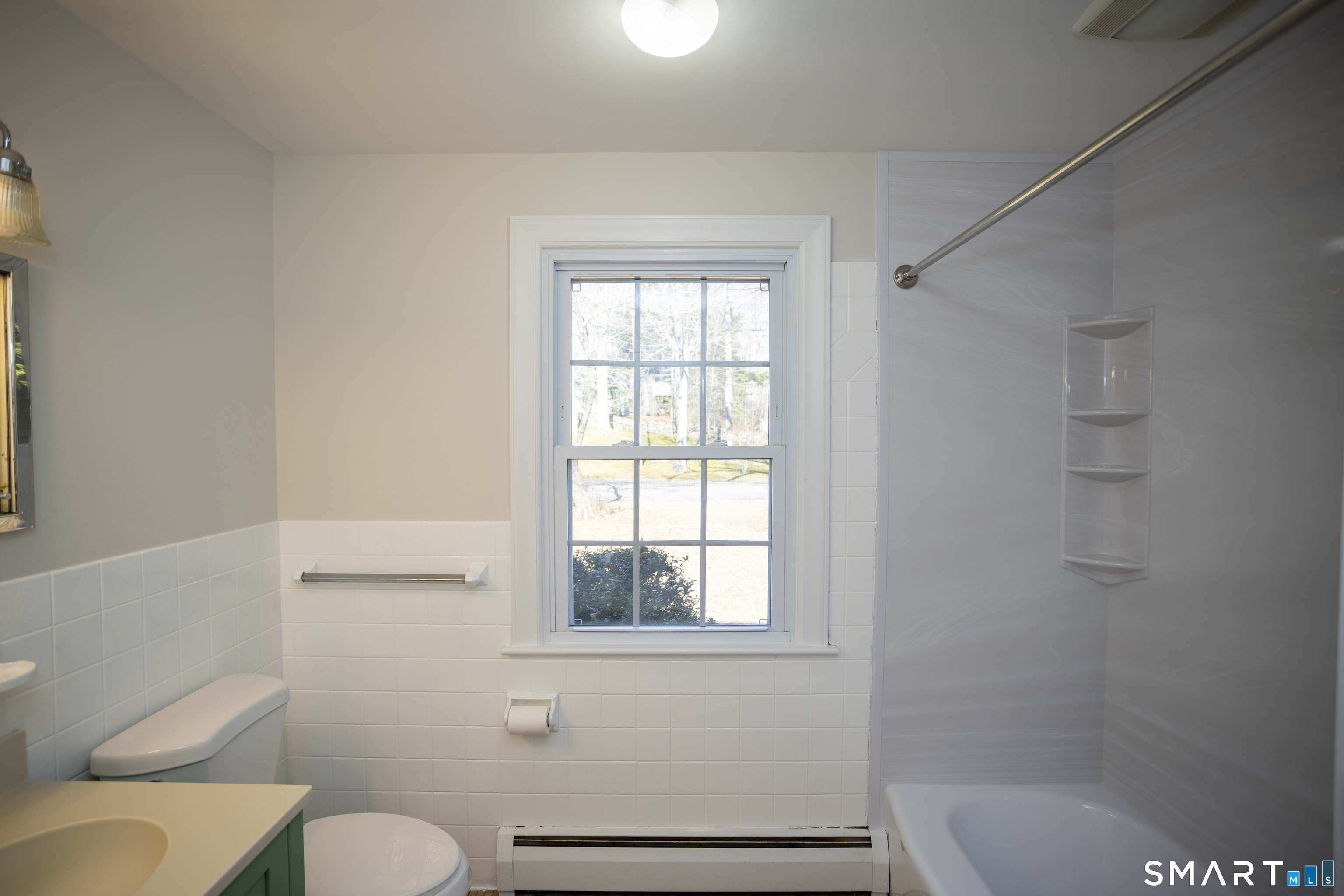 10 Cove Hill Road Essex, CT 06426 - Photo 36 of 38 a bathroom with a toilet and a shower