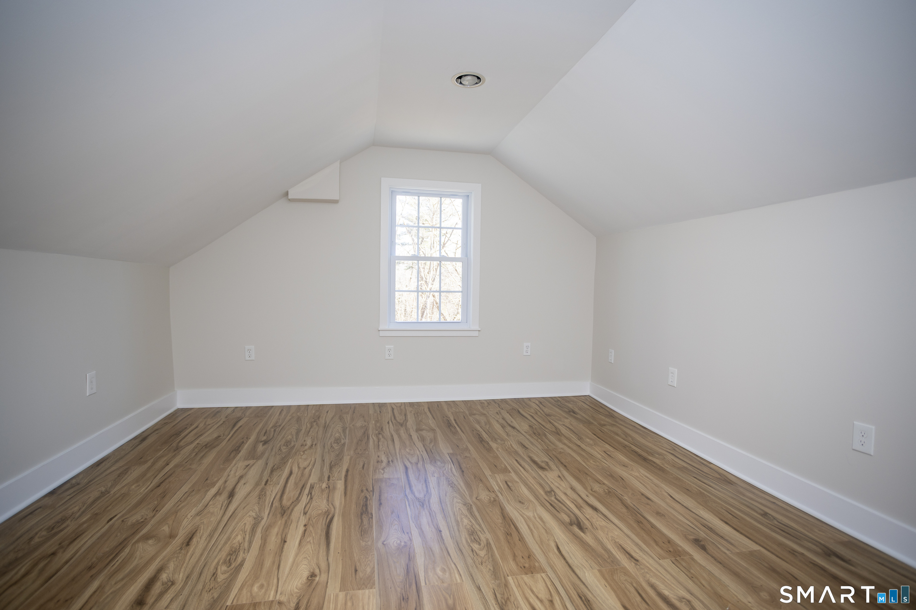 10 Cove Hill Road Essex, CT 06426 - Photo 37 of 38 an empty room with wooden floor and windows