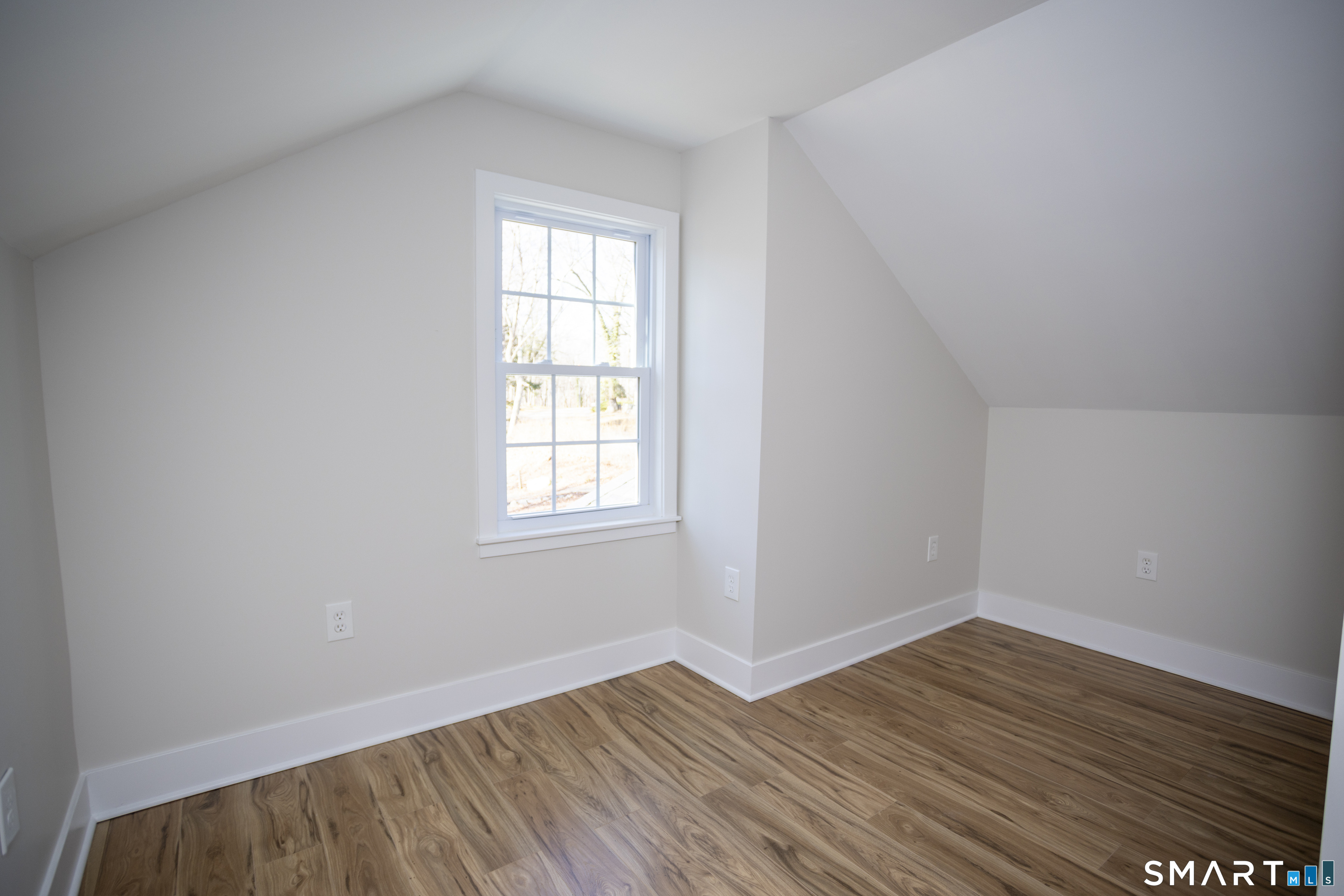10 Cove Hill Road Essex, CT 06426 - Photo 38 of 38 an empty room with wooden floor and windows