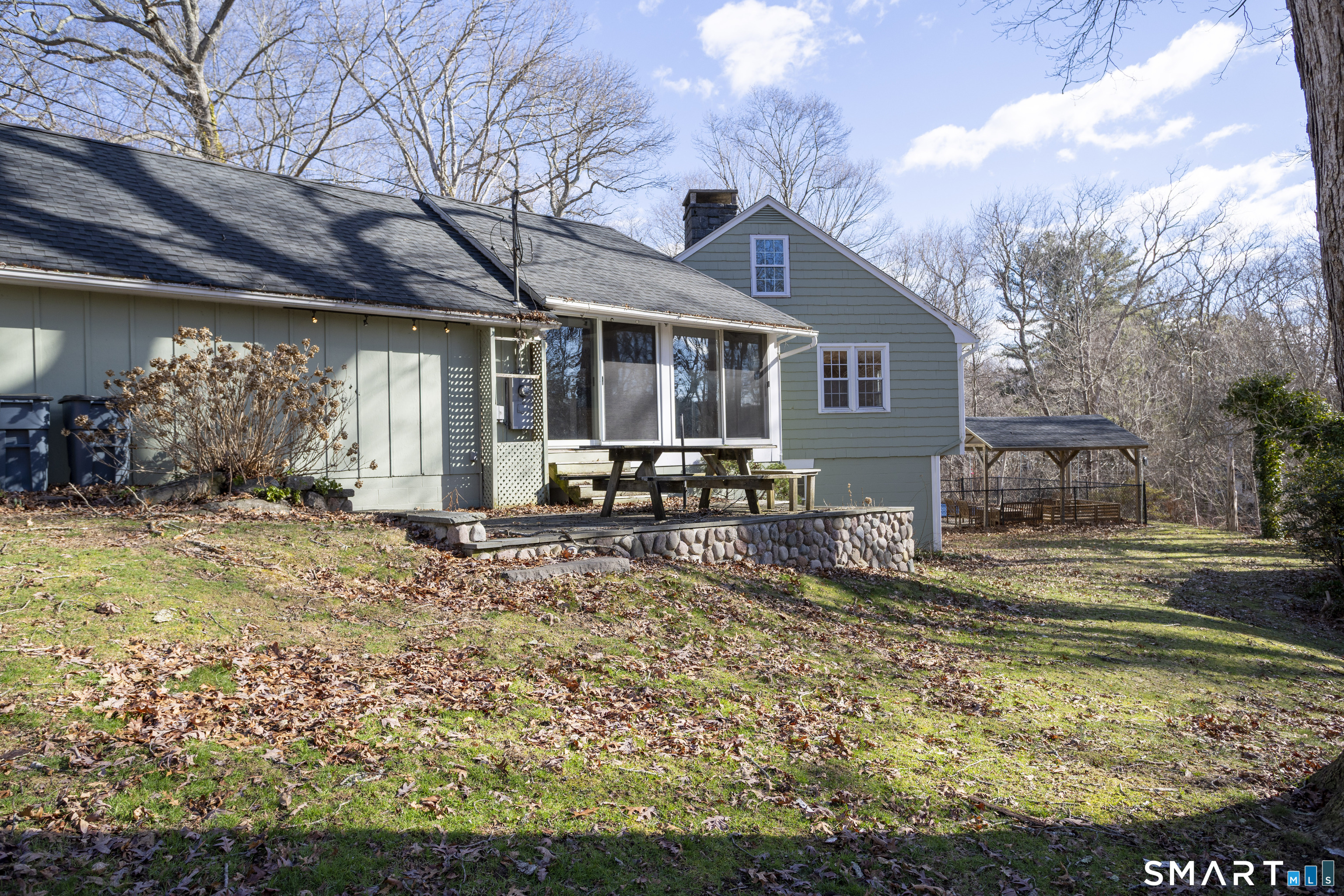 10 Cove Hill Road Essex, CT 06426 - Photo 4 of 38 a view of a house with backyard and sitting area