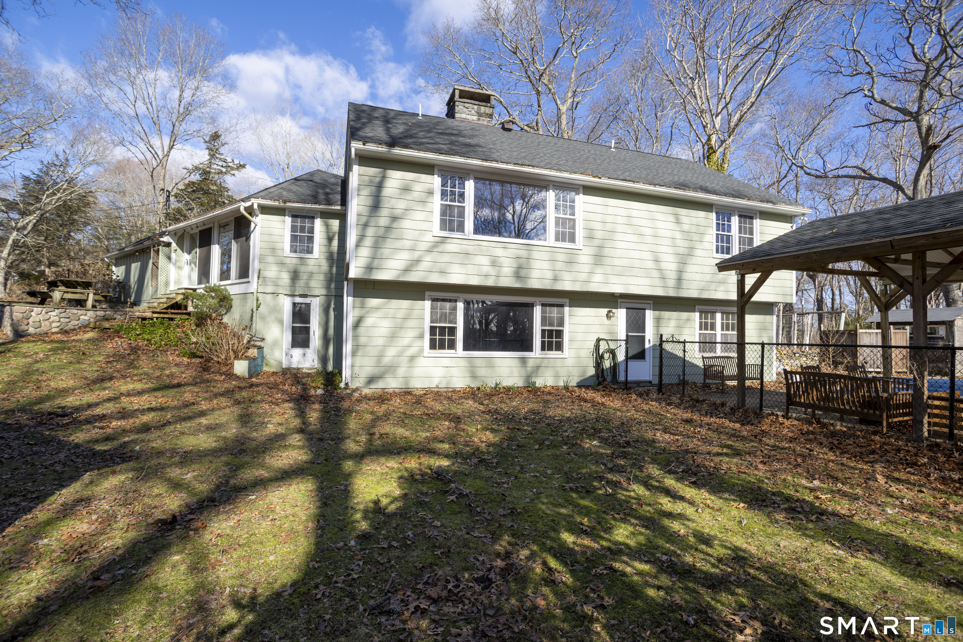 10 Cove Hill Road Essex, CT 06426 - Photo 5 of 38 a front view of a house with a yard