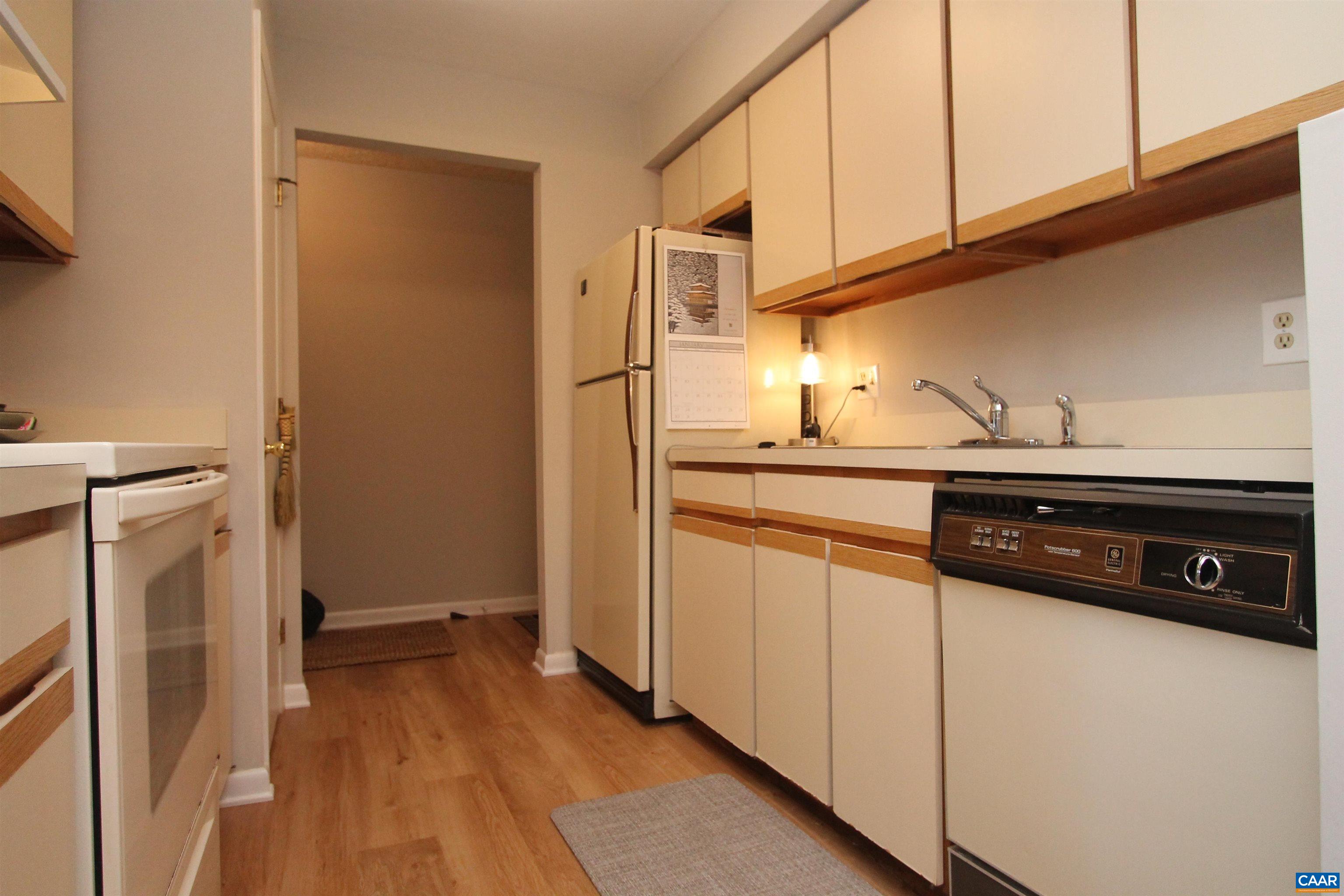 130 Turtle Creek Road, Unit 2 Charlottesville, VA 22901 - Photo 6 of 10 a kitchen that has a sink a stove and a refrigerator