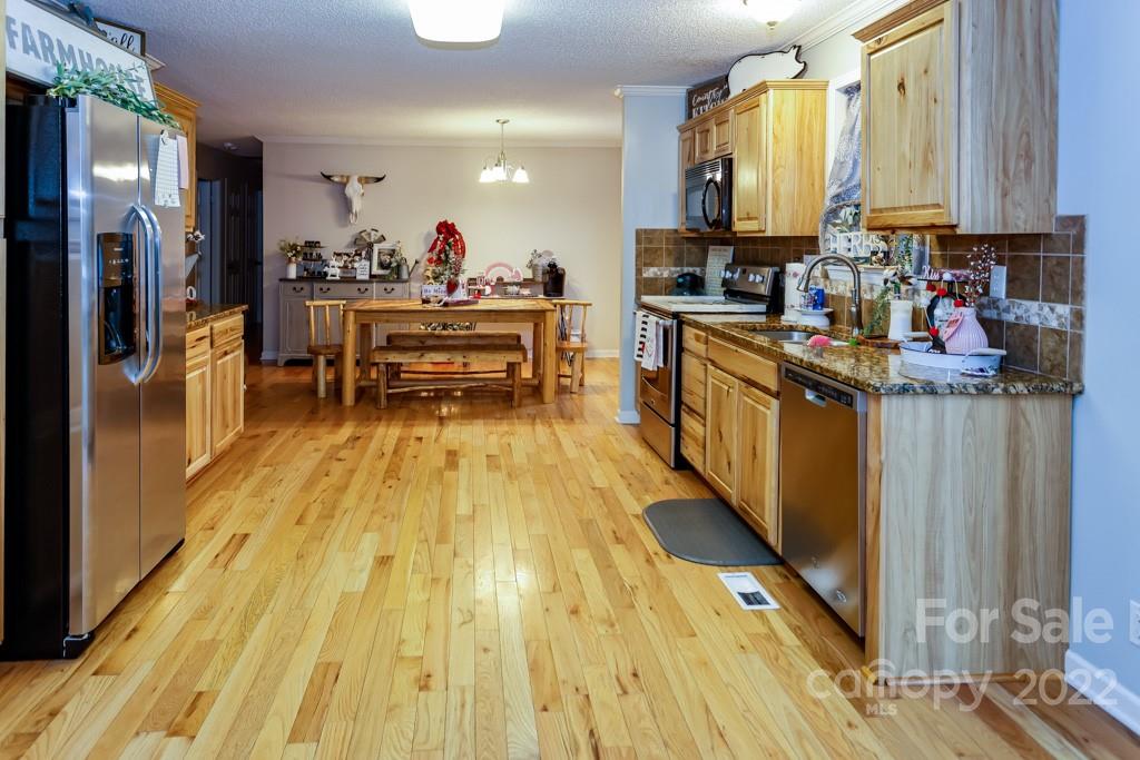 890 Rock Road Rutherfordton, NC 28139 - Photo 12 of 40 a kitchen with stainless steel appliances a stove a sink and a refrigerator