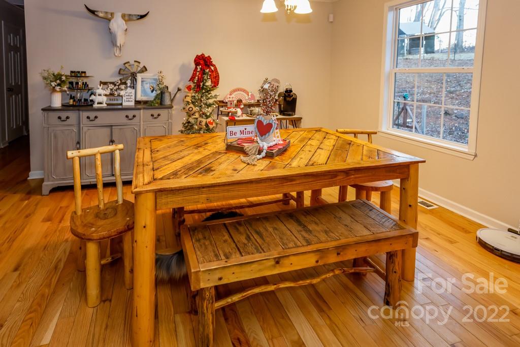 890 Rock Road Rutherfordton, NC 28139 - Photo 15 of 40 a view of a dining room with furniture and chandelier