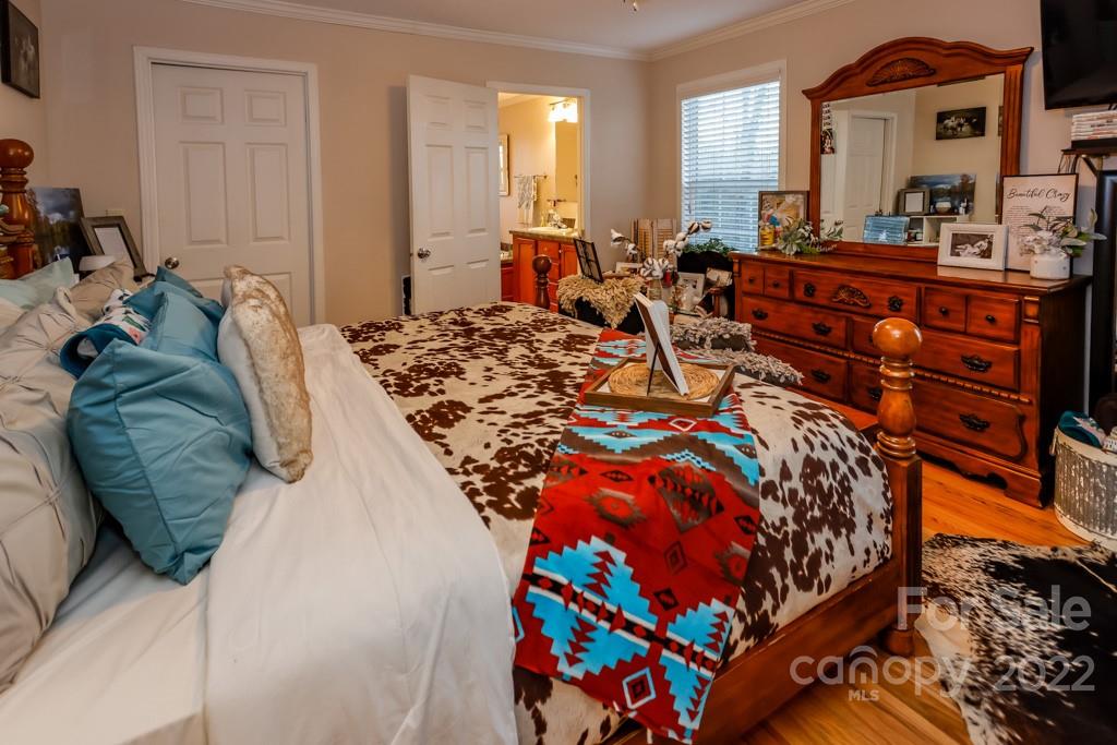 890 Rock Road Rutherfordton, NC 28139 - Photo 16 of 40 a bed sitting in a bedroom next to a window