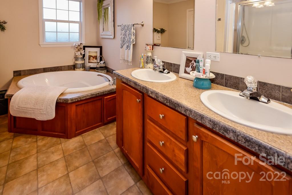 890 Rock Road Rutherfordton, NC 28139 - Photo 18 of 40 a bathroom with a sink and a mirror