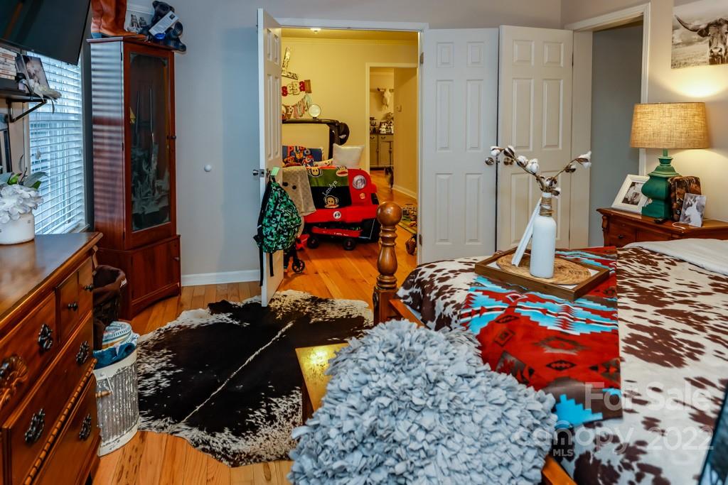 890 Rock Road Rutherfordton, NC 28139 - Photo 20 of 40 a bedroom with bed and a mirror