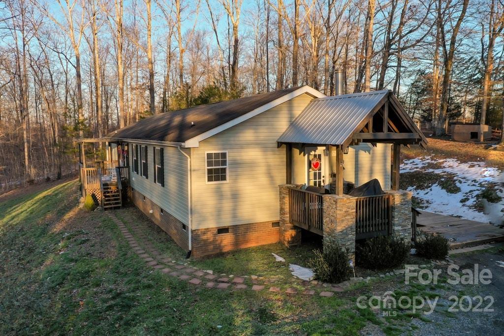 890 Rock Road Rutherfordton, NC 28139 - Photo 2 of 40 a view of a house with a yard and furniture