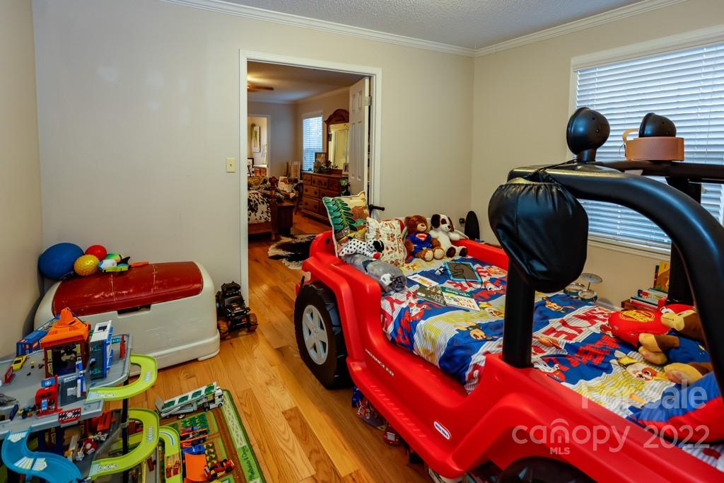 890 Rock Road Rutherfordton, NC 28139 - Photo 22 of 40 a bedroom with a bed and toys in it