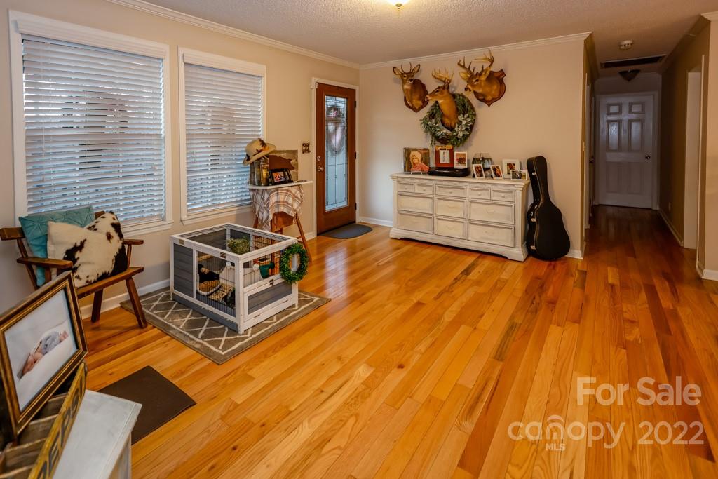 890 Rock Road Rutherfordton, NC 28139 - Photo 23 of 40 a living room with hard wood flooring and furniture