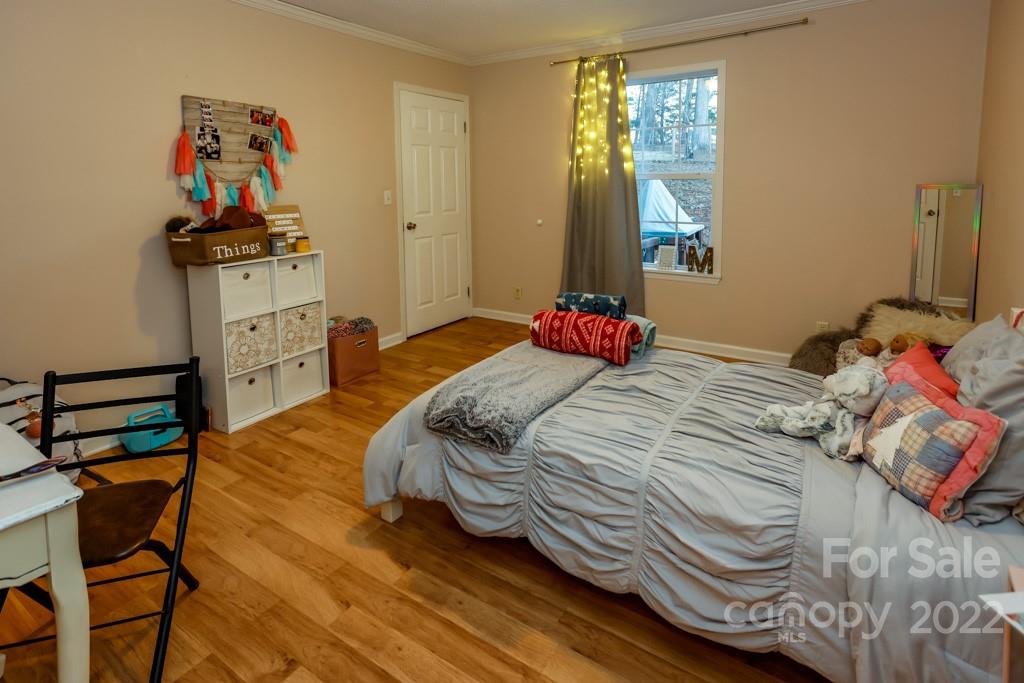 890 Rock Road Rutherfordton, NC 28139 - Photo 26 of 40 a bedroom with a bed and a dresser