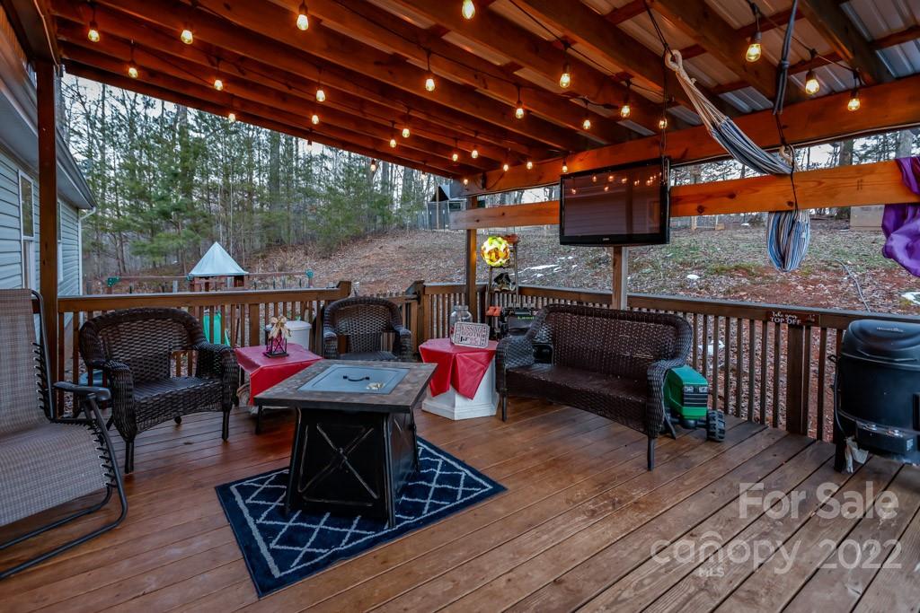 890 Rock Road Rutherfordton, NC 28139 - Photo 29 of 40 a living room with furniture a piano and wooden floor