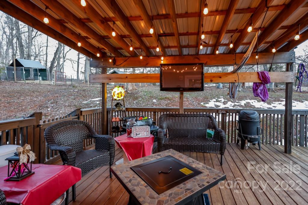 890 Rock Road Rutherfordton, NC 28139 - Photo 30 of 40 a view of a chairs and table in a patio