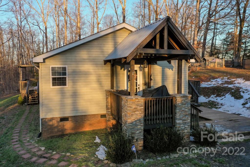 890 Rock Road Rutherfordton, NC 28139 - Photo 3 of 40 a front view of a house with garden