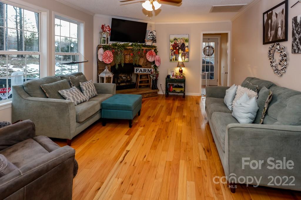 890 Rock Road Rutherfordton, NC 28139 - Photo 7 of 40 a living room with furniture and a flat screen tv