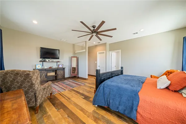 a view of walk in closet with clothes