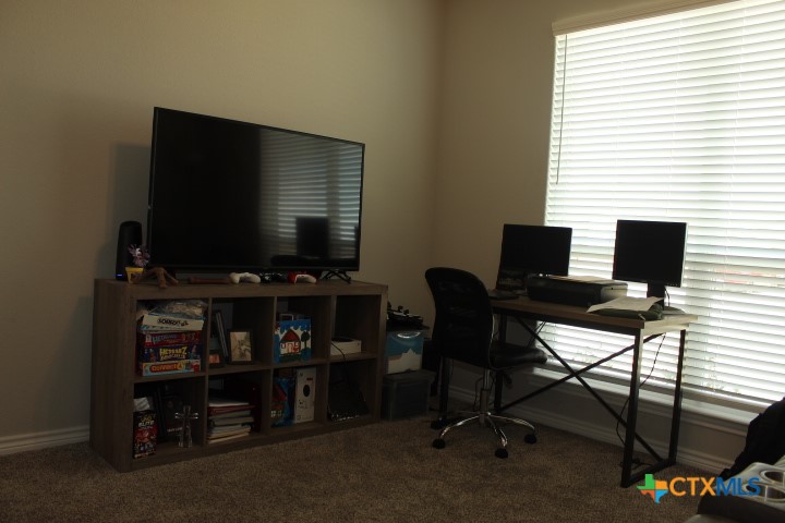 3006 Hedwig Street Killeen, TX 76549 - Photo 12 of 14 a view of a workspace with furniture and a window