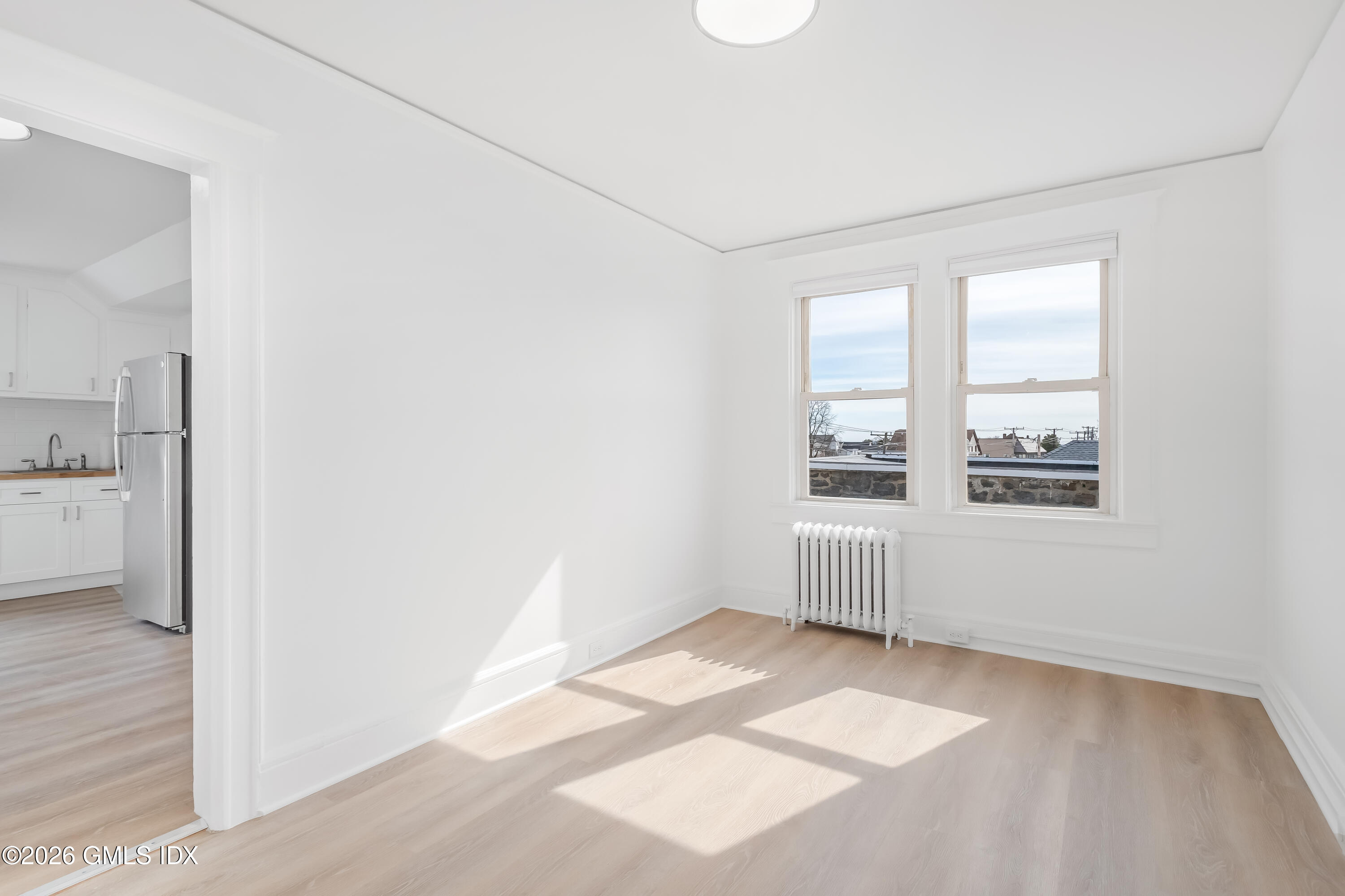 140 Hamilton Avenue, Unit 3 Greenwich, CT 06830 - Photo 5 of 11 a view of an empty room with a window
