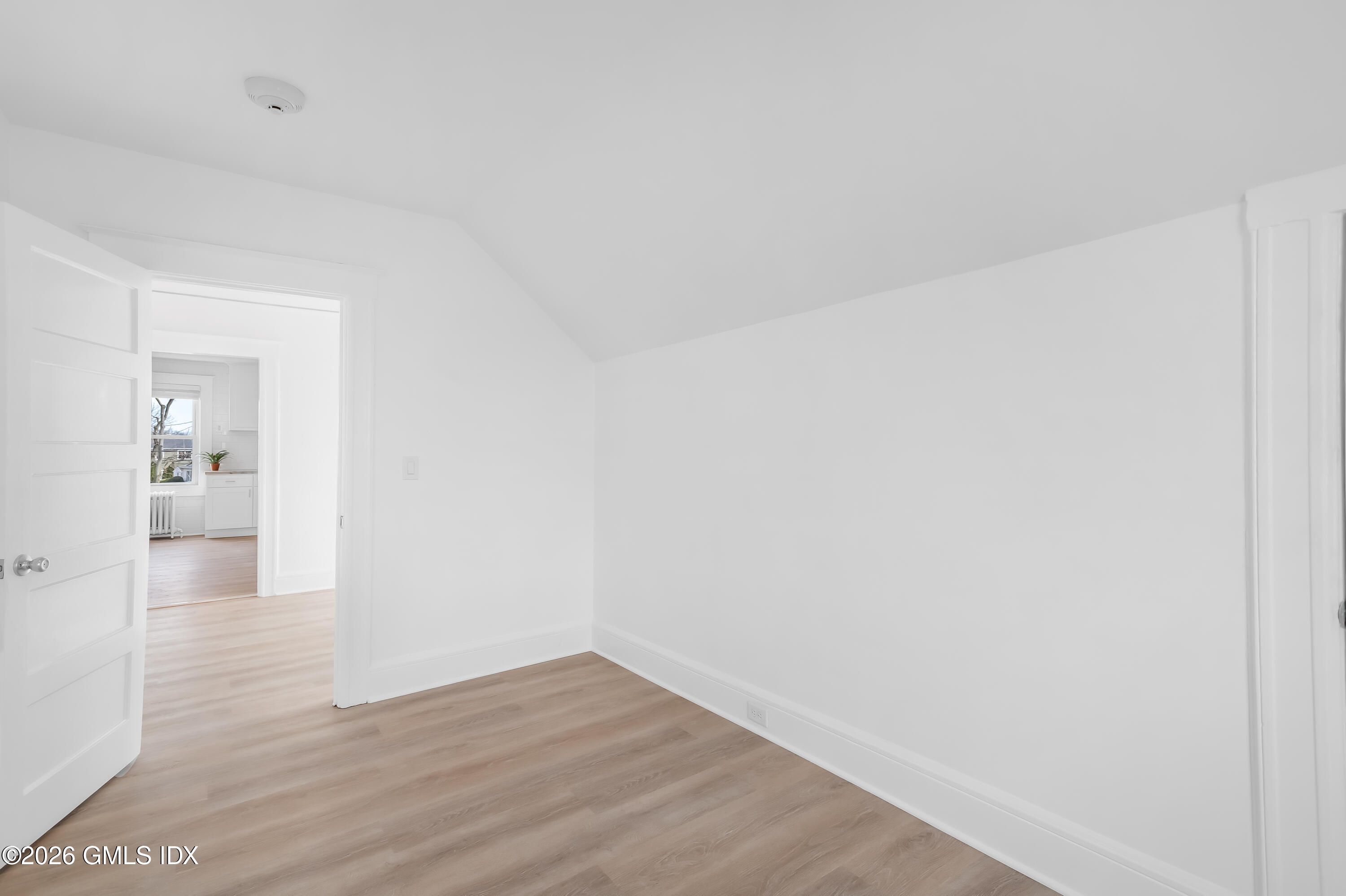 140 Hamilton Avenue, Unit 3 Greenwich, CT 06830 - Photo 6 of 11 a view of an empty room and wooden floor