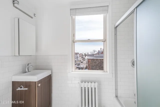 a bathroom with a sink and a window