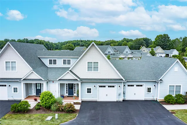 an aerial view of house with yard and entertaining space
