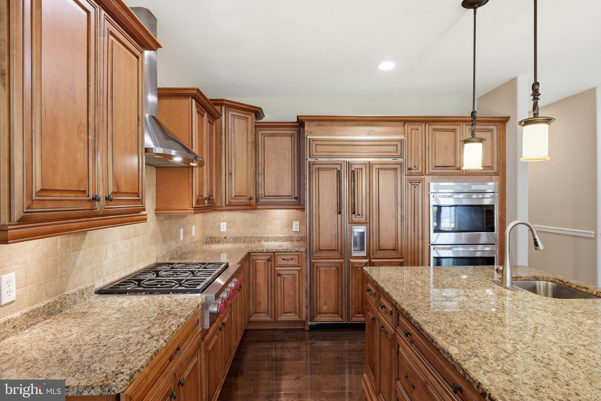 16932 Fitzgeralds Road Lincoln, DE 19960 - Photo 57 of 103 Elegant kitchen with rich wood cabinetry.