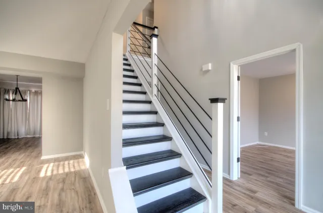 a view of an entryway door and hallway