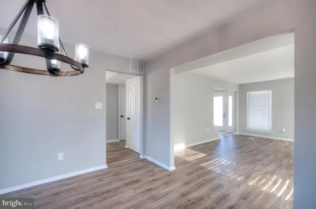 a kitchen with stainless steel appliances granite countertop a refrigerator a stove a sink and a microwave