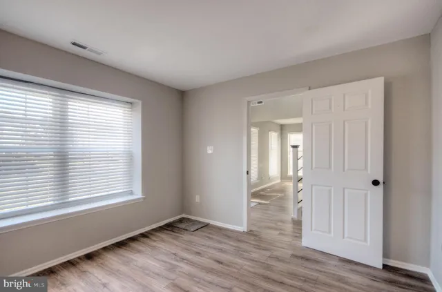 a view of a kitchen cabinets and a counter top space