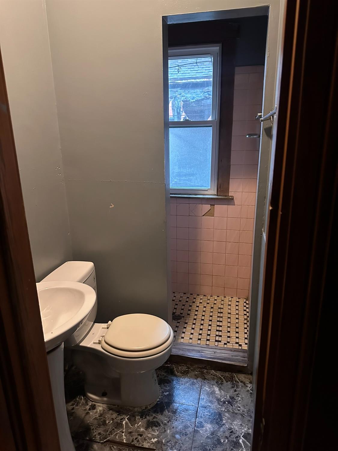 816 Vermont Street Gary, IN 46402 - Photo 3 of 9 a bathroom with a toilet and a sink