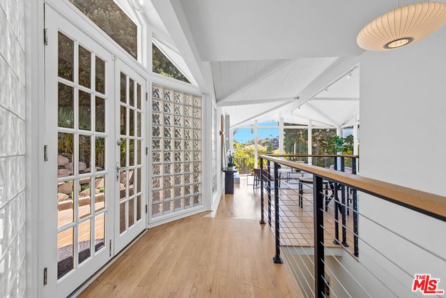 a spacious bedroom with a bed and a large window