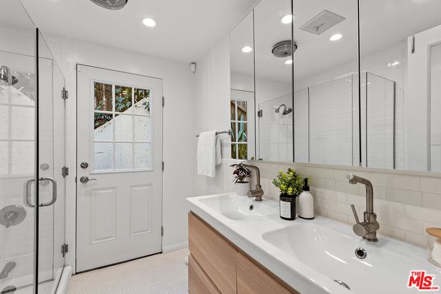 a bedroom with a bed and a lamp