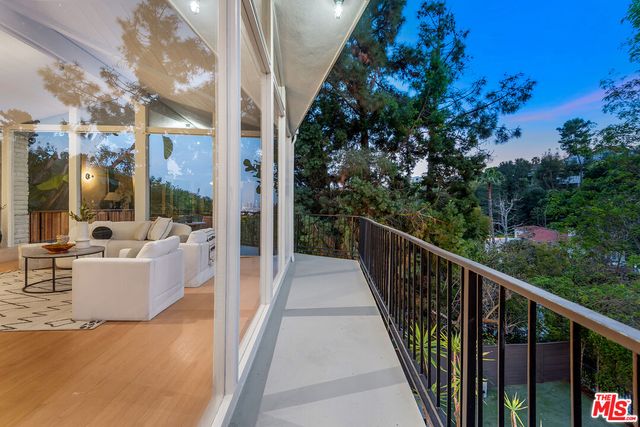 a view of a patio with wooden floor