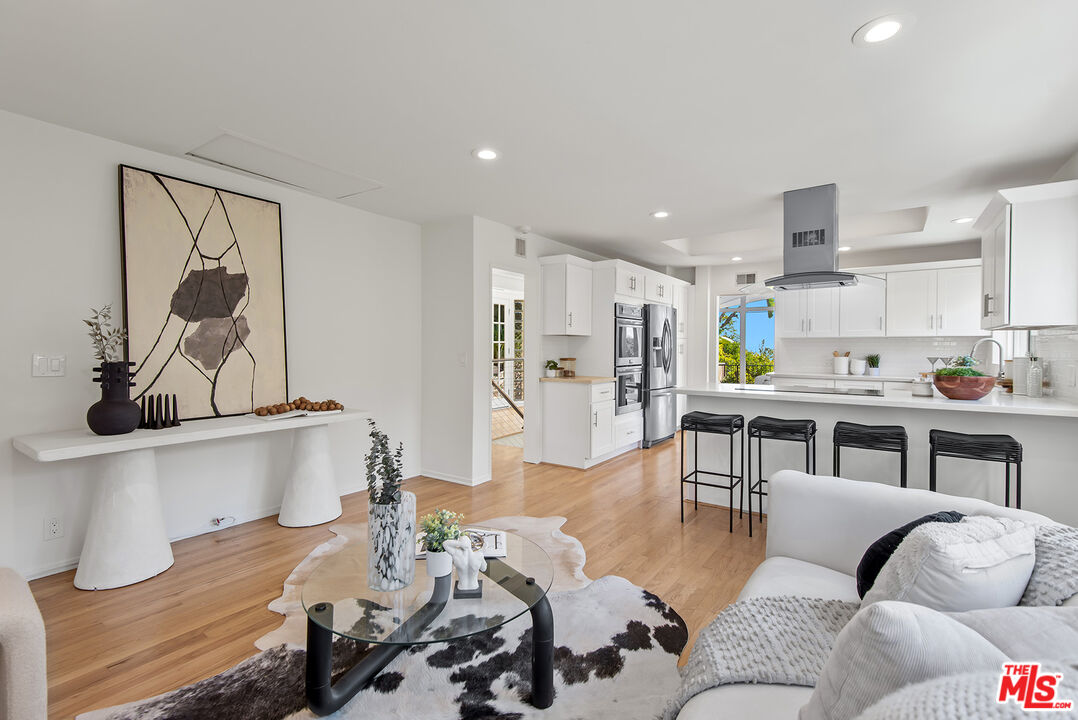7229 Senalda Road Los Angeles, CA 90068 - Photo 9 of 24 a living room with furniture and kitchen view
