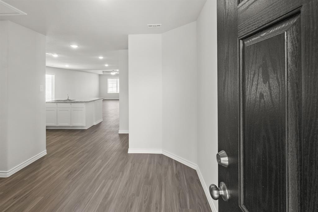 10024 Freighter Trail Fort Worth, TX 76131 - Photo 3 of 14 a walk in closet with wooden floor