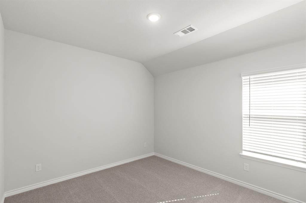 10024 Freighter Trail Fort Worth, TX 76131 - Photo 9 of 14 an empty room with a window