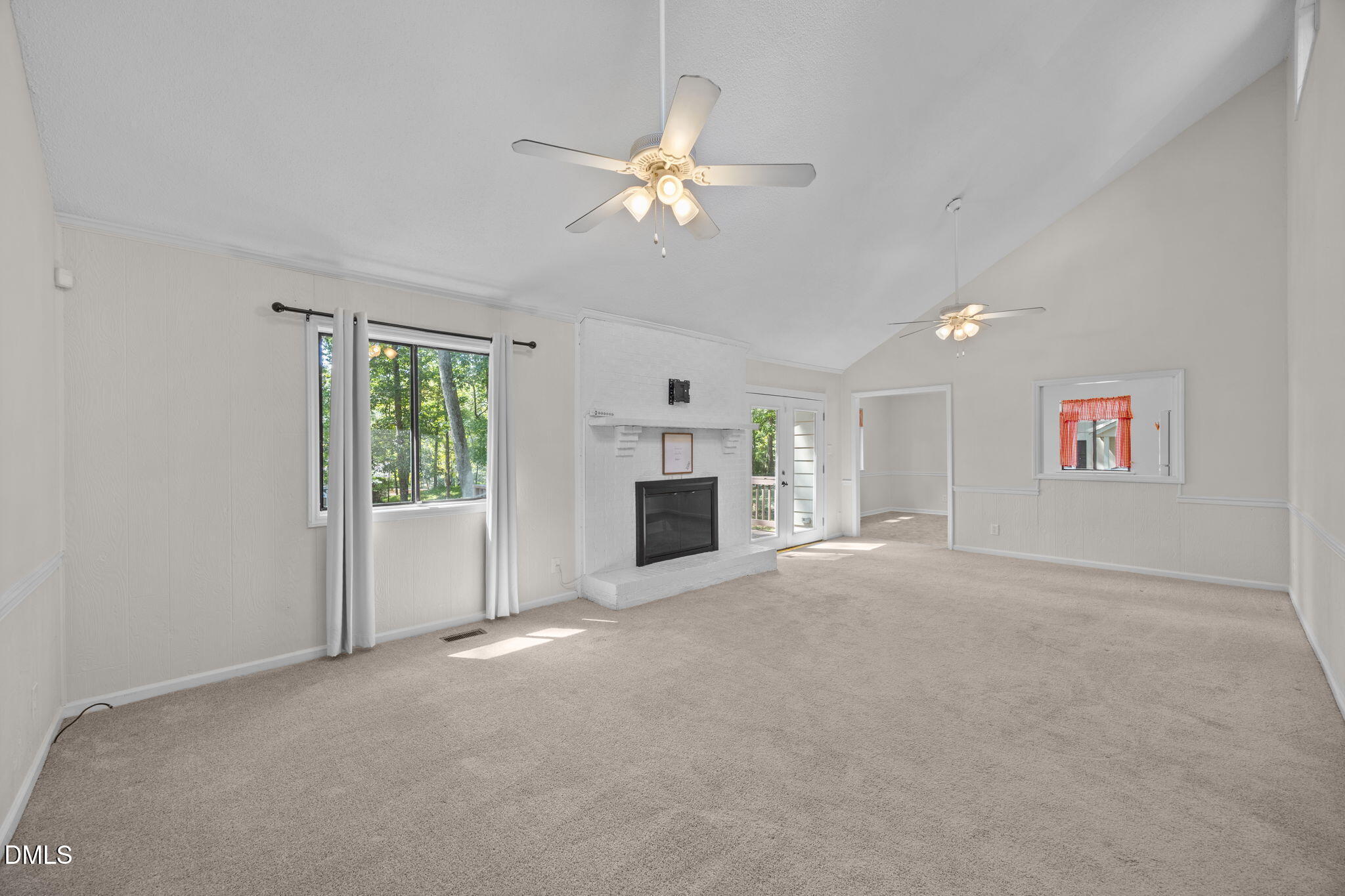 904 Snow Hill Road Durham, NC 27712 - Photo 11 of 41 an empty room with windows and fireplace